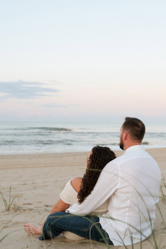 couple looking off at the beach together in virginia beach