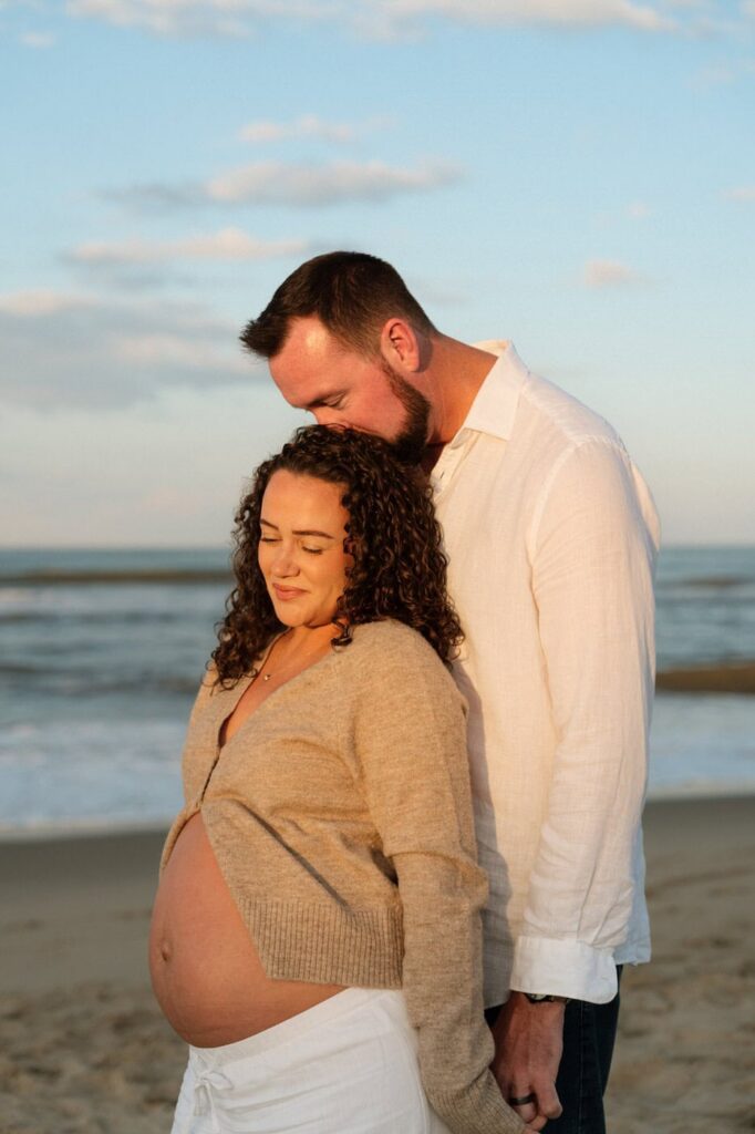 golden hour maternity session on the beach in virginia beach