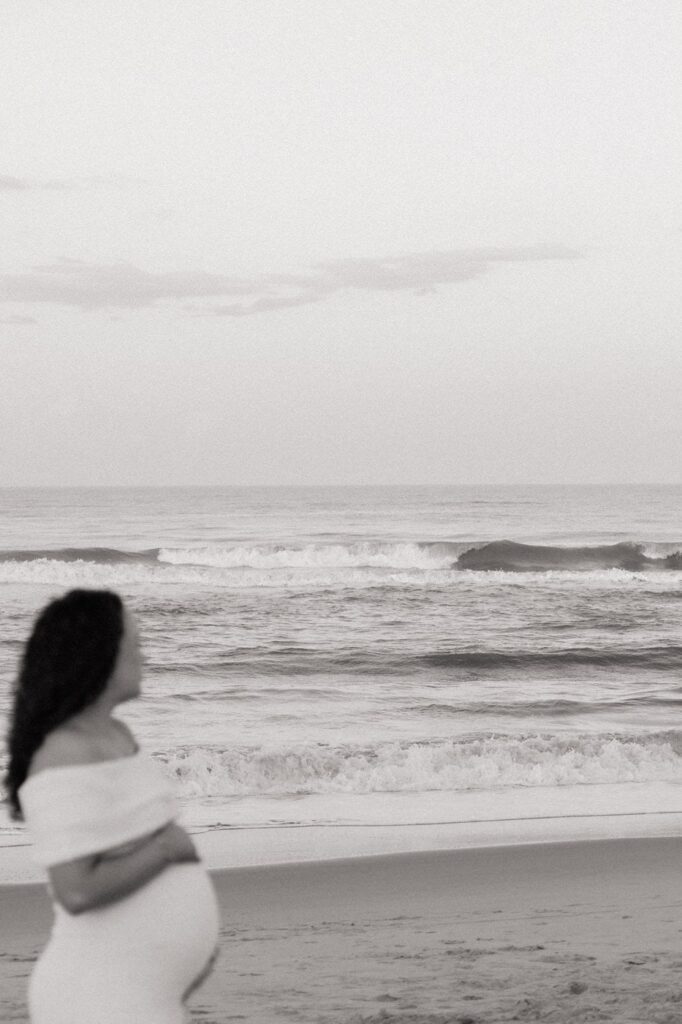 girl looking at the waves in virginia beach