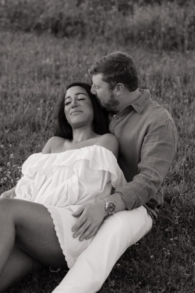 couple laying in the grass at bells bend