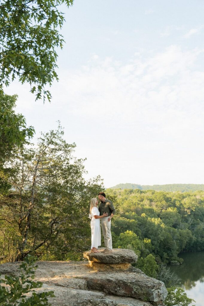 couple standing on the bluffs at narrows of the harpeth engagement session in tennessee