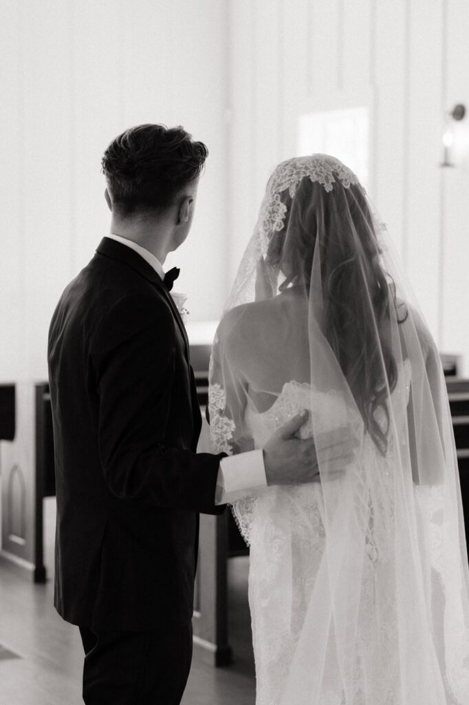 couple sharing an emotional moment after first look at the venue at birchwood in tennessee