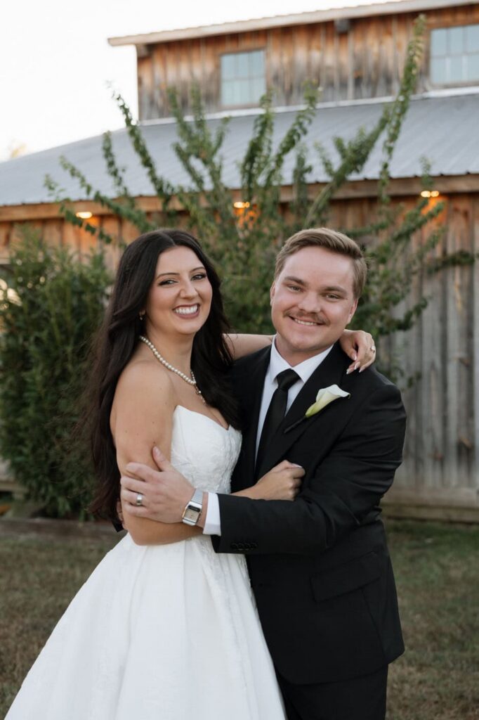 bride and groom laughing during newlywed portraits