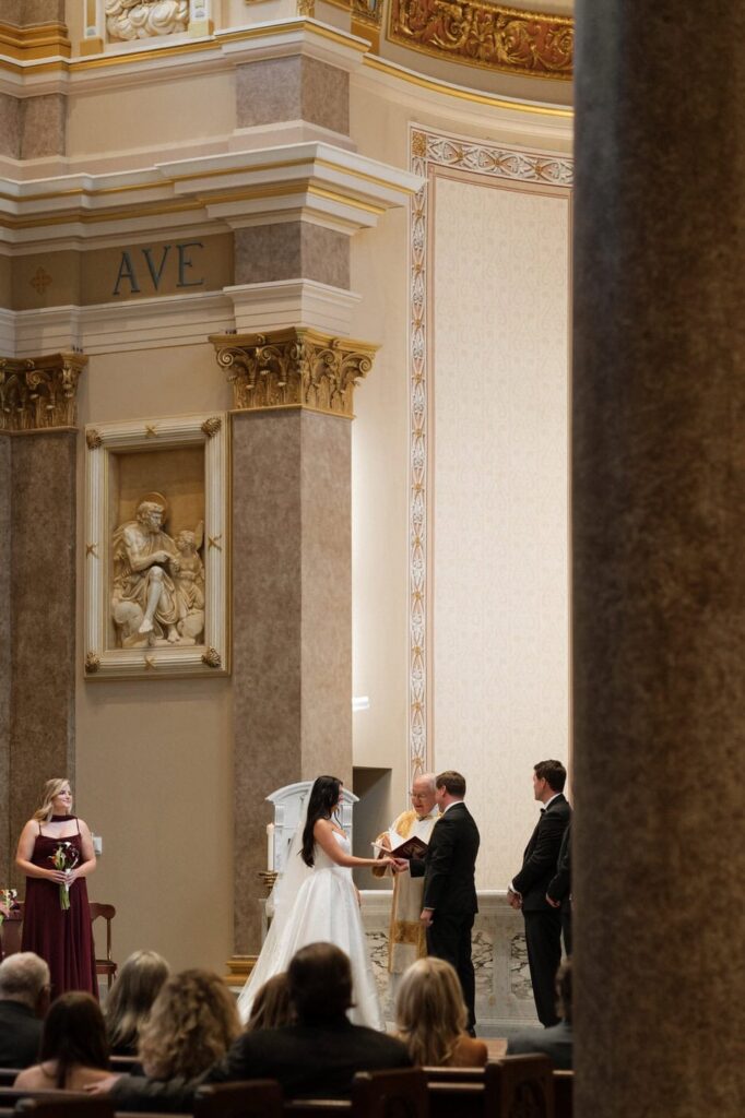 couple saying vows during catholic wedding at the cathedral of the incarnation in nashville