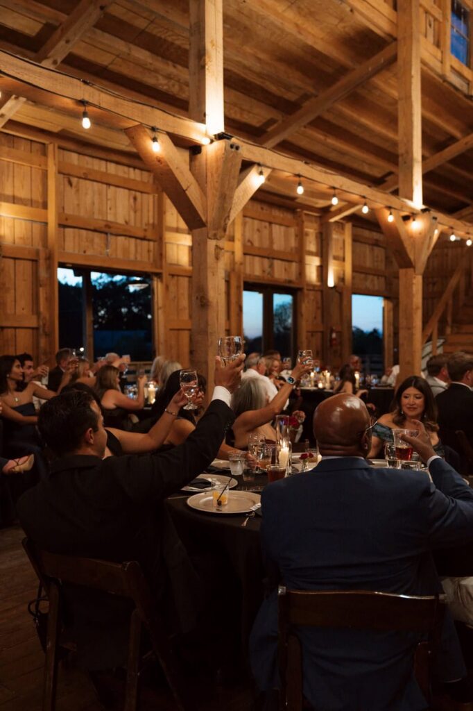 guests raising their glasses at copperline ranch wedding reception
