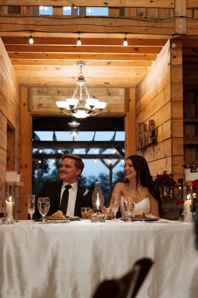 bride and groom laughing during toasts at copperline ranch wedding reception in nashville