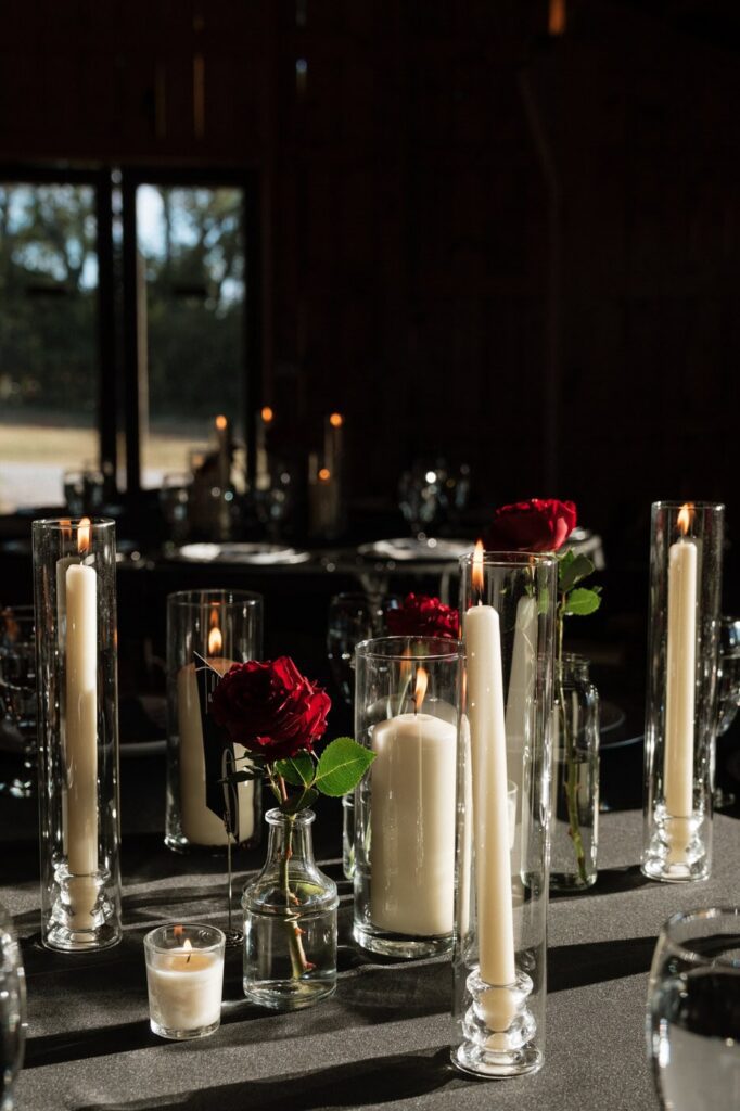 sunlight shining on the candles and roses at wedding reception in nashville