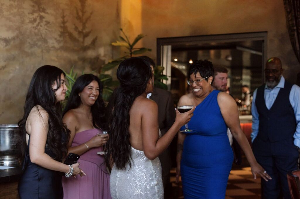 candid moment of bride and her guests at intimate wedding reception at the twelve thirty club in nashville